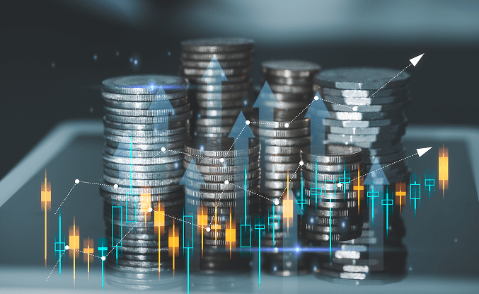 Stacks of coins with financial chart overlays showing growth.