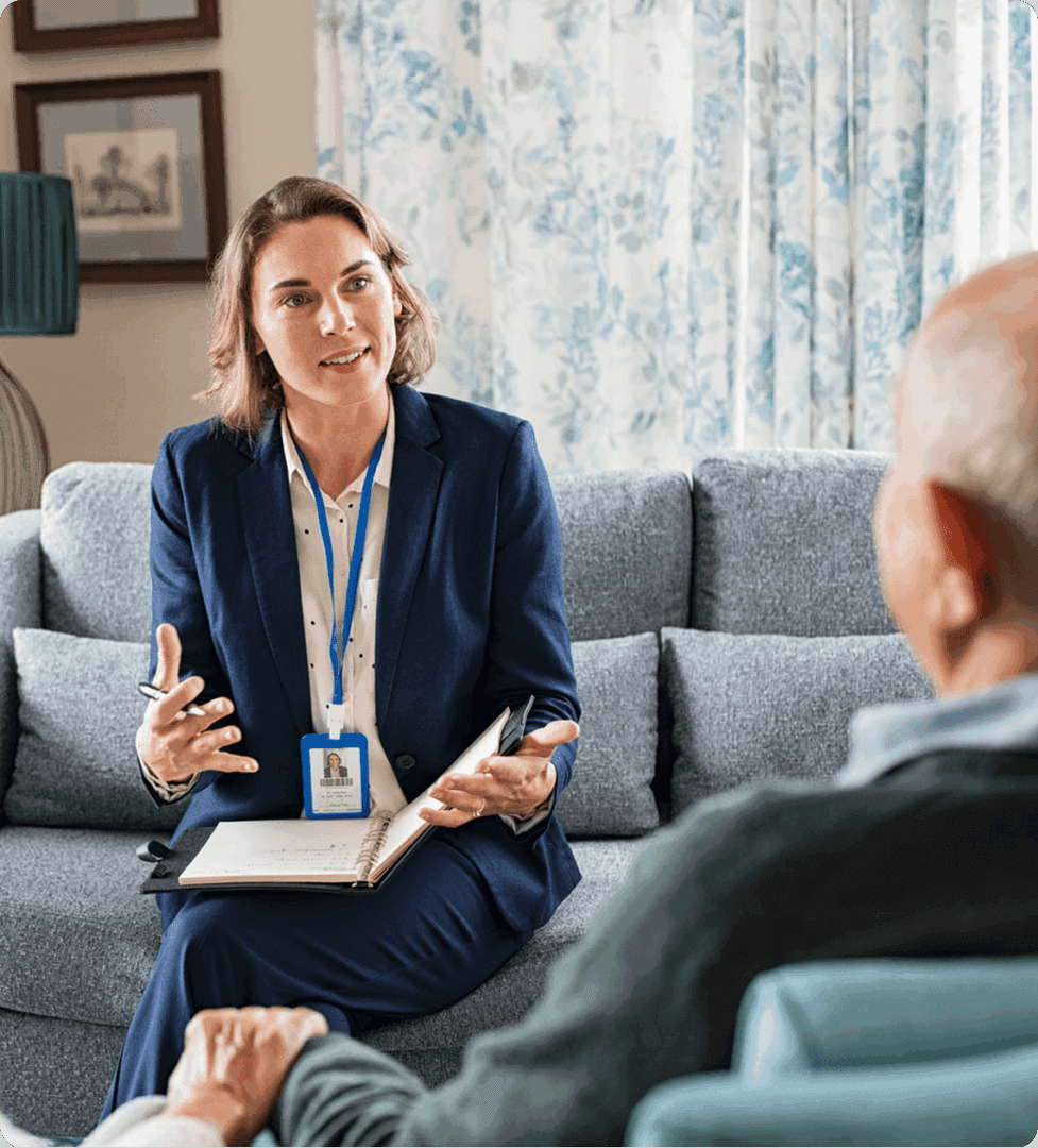 Professional woman talking to senior man