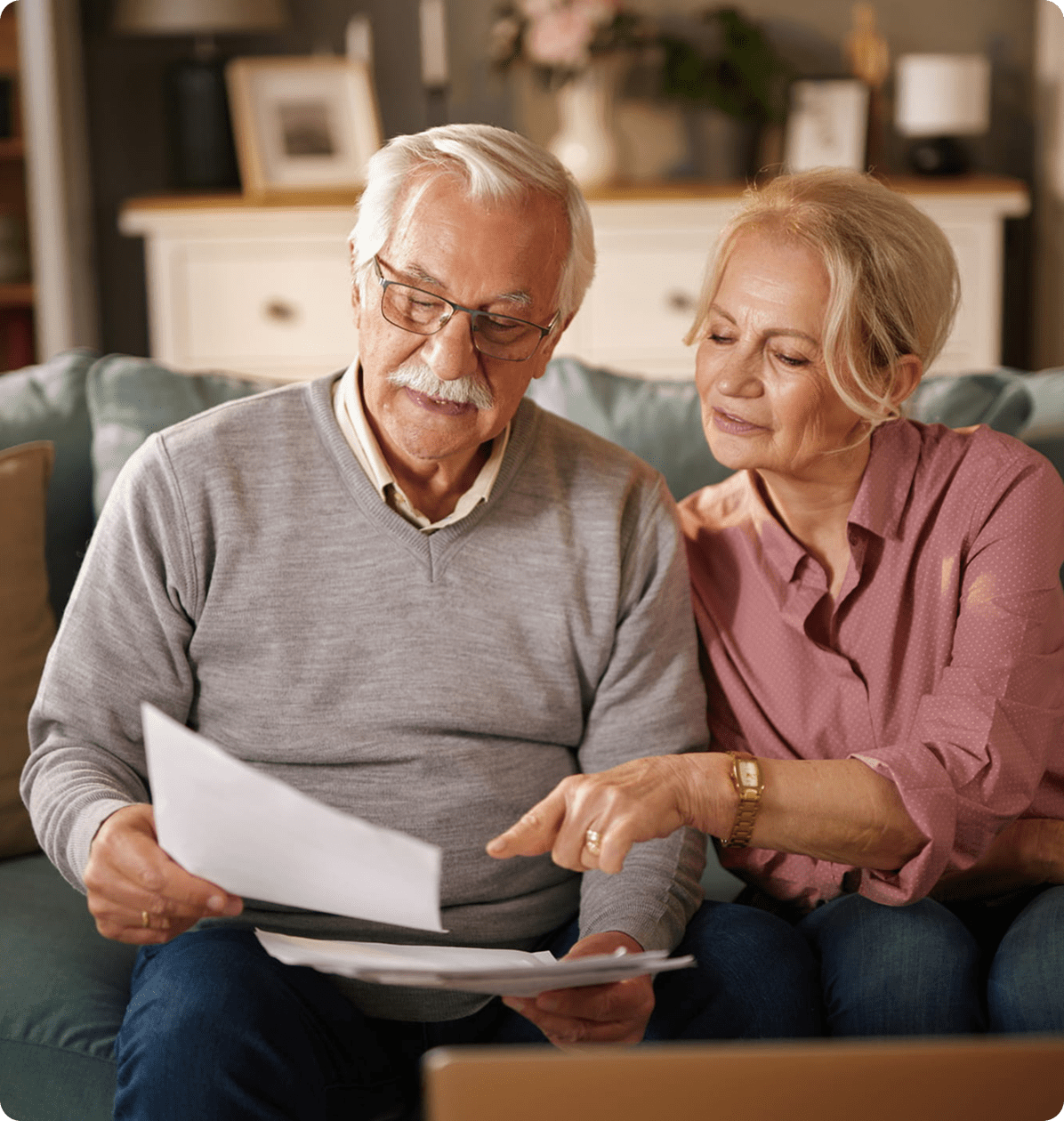 Seniors discussing paperwork at home
